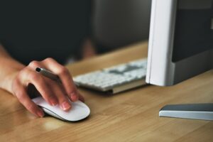 hand on computer mouse